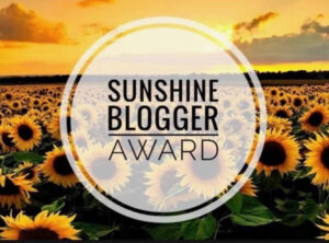 questo è il logo del sunshine blogger award, riconoscimento virtuale del blogging